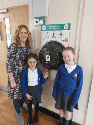Students at Ysgol Bryn Coch School with their new defibrillator